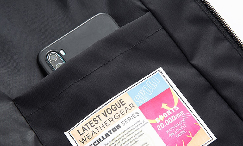 Inner pocket of Sports Men's Hooded Thin Jacket SF0864 with cellphone and weatherproof label, showcasing durability.